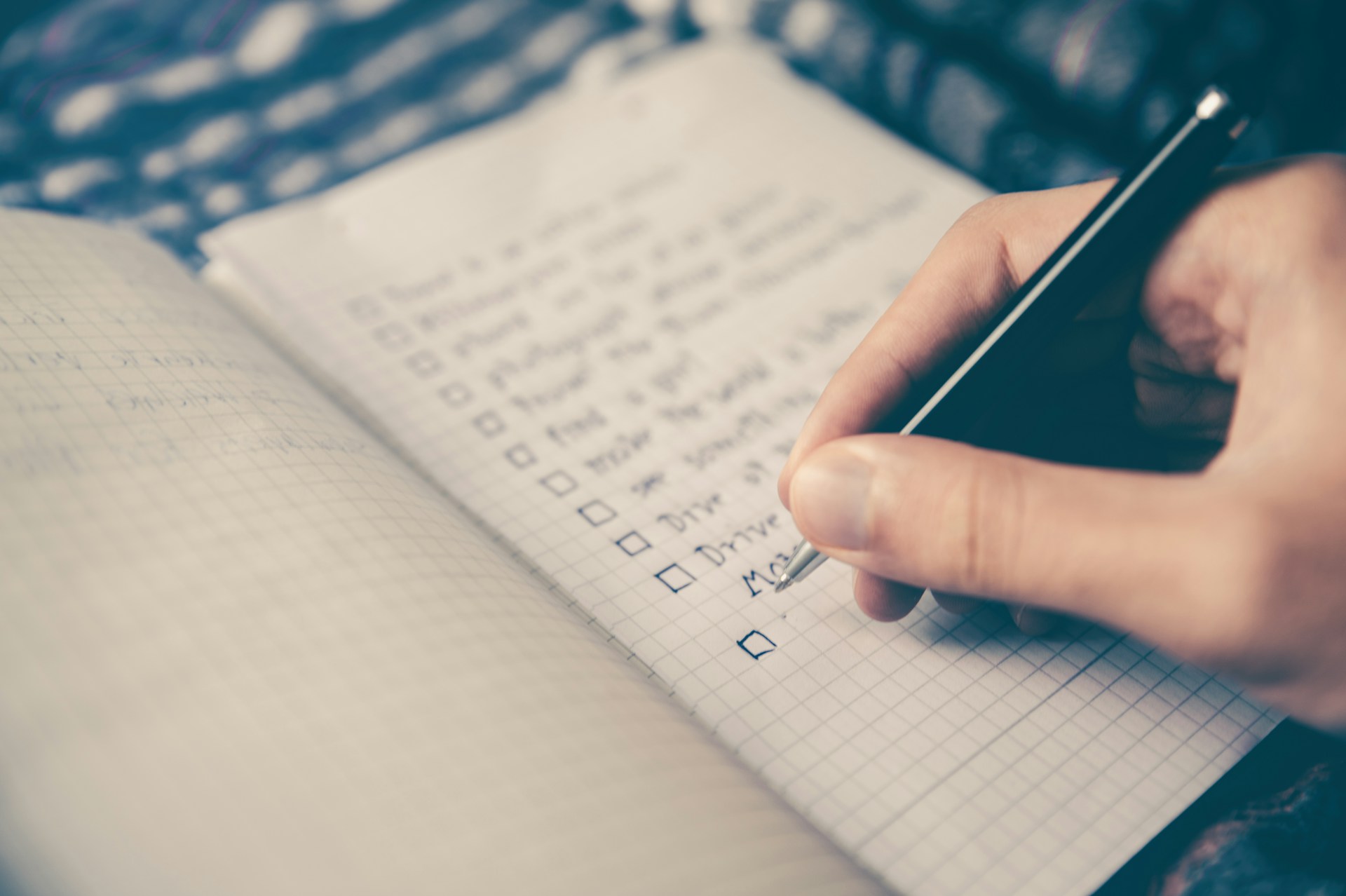 Open notebook with vault tier outline beside a laptop showing a governance checklist